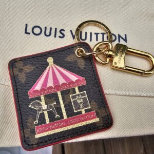 Louis Vuitton Illustre Pink Carousel key holder and bag charm in Monogram canvas with a pink carousel illustration and gold-tone clasp