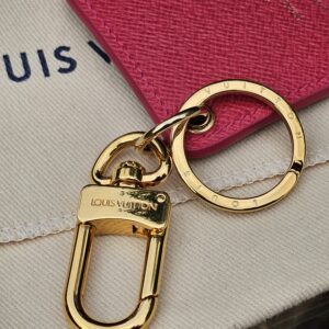 Gold-tone key ring and clasp on the Louis Vuitton Illustre Pink Carousel charm