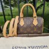 Louis Vuitton Nano Speedy Bandouliere in Monogram canvas shown with its removable vachetta strap and Louis Vuitton dust bag