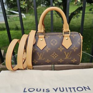 Louis Vuitton Nano Speedy Bandouliere in Monogram canvas shown with its removable vachetta strap and Louis Vuitton dust bag