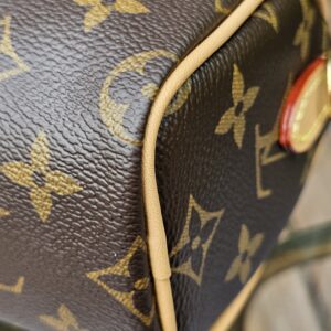 Base corner of the Louis Vuitton Nano Speedy Bandouliere with vachetta piping and Monogram canvas