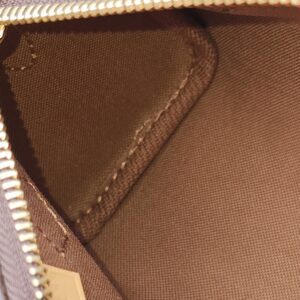Brown textile lining and interior seams of the Louis Vuitton Nano Speedy Bandouliere
