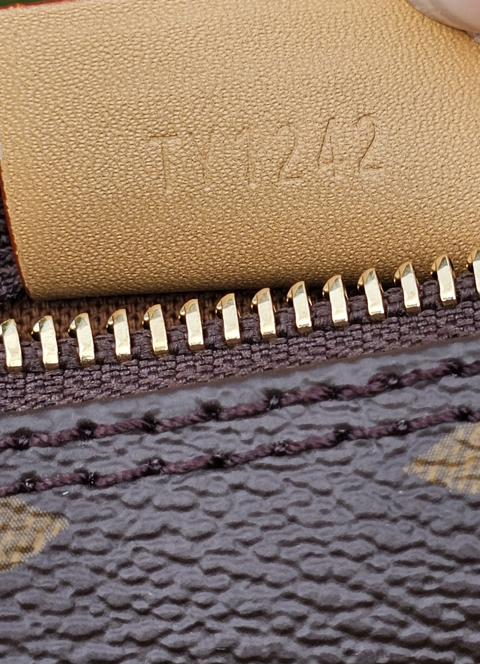 Date code TY1242 heat stamped inside the Louis Vuitton Nano Speedy Bandouliere