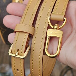 Removable adjustable vachetta leather crossbody strap for the Louis Vuitton Nano Speedy Bandouliere held in hand