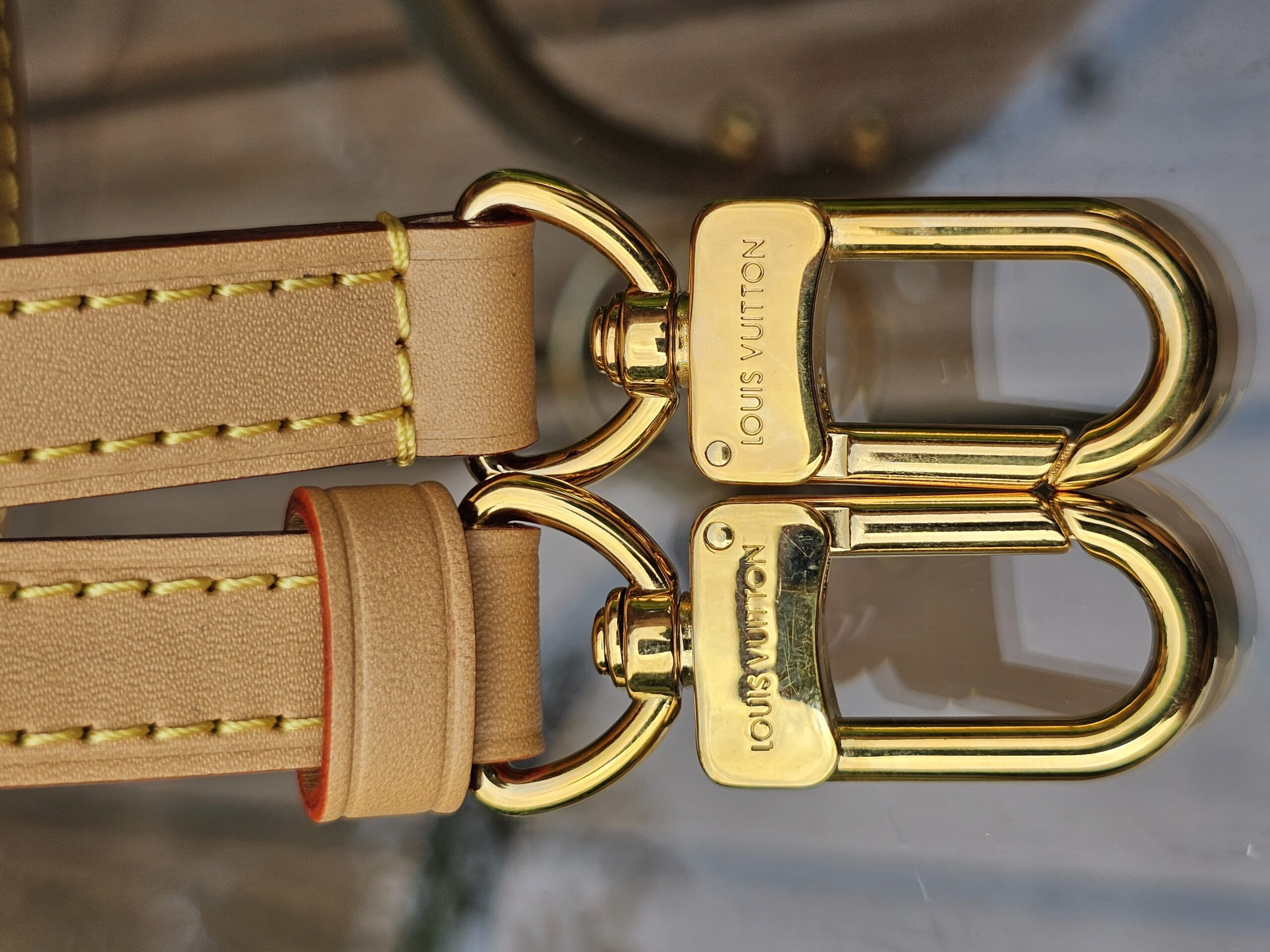 Gold-tone hook clasps on the removable strap of the Louis Vuitton Nano Speedy Bandouliere