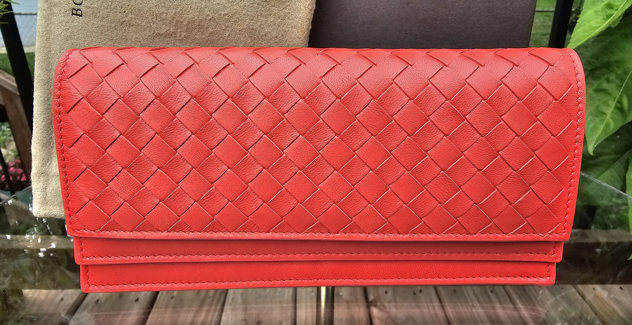 Bottega Veneta continental flap wallet in Cassis Nappa leather with the Intrecciato woven weave