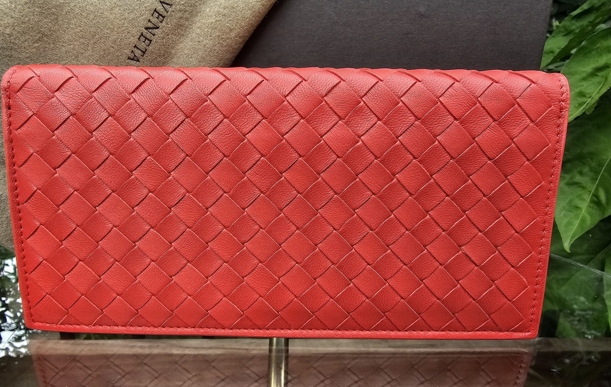 Front of the Bottega Veneta continental flap wallet showing the woven Intrecciato Nappa leather