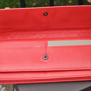 Interior of the Bottega Veneta continental wallet with card slots and bill compartments in Cassis leather