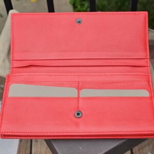 Card slots and full length bill compartments inside the Bottega Veneta Intrecciato wallet