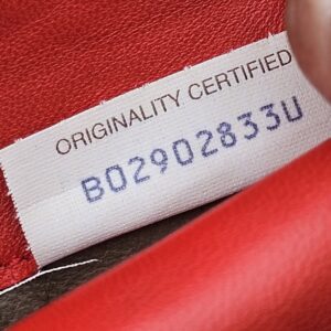 Originality Certified tag reading B02902833U inside the Bottega Veneta Intrecciato wallet