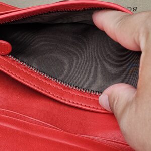 Zip pocket inside the Bottega Veneta Cassis Intrecciato continental wallet