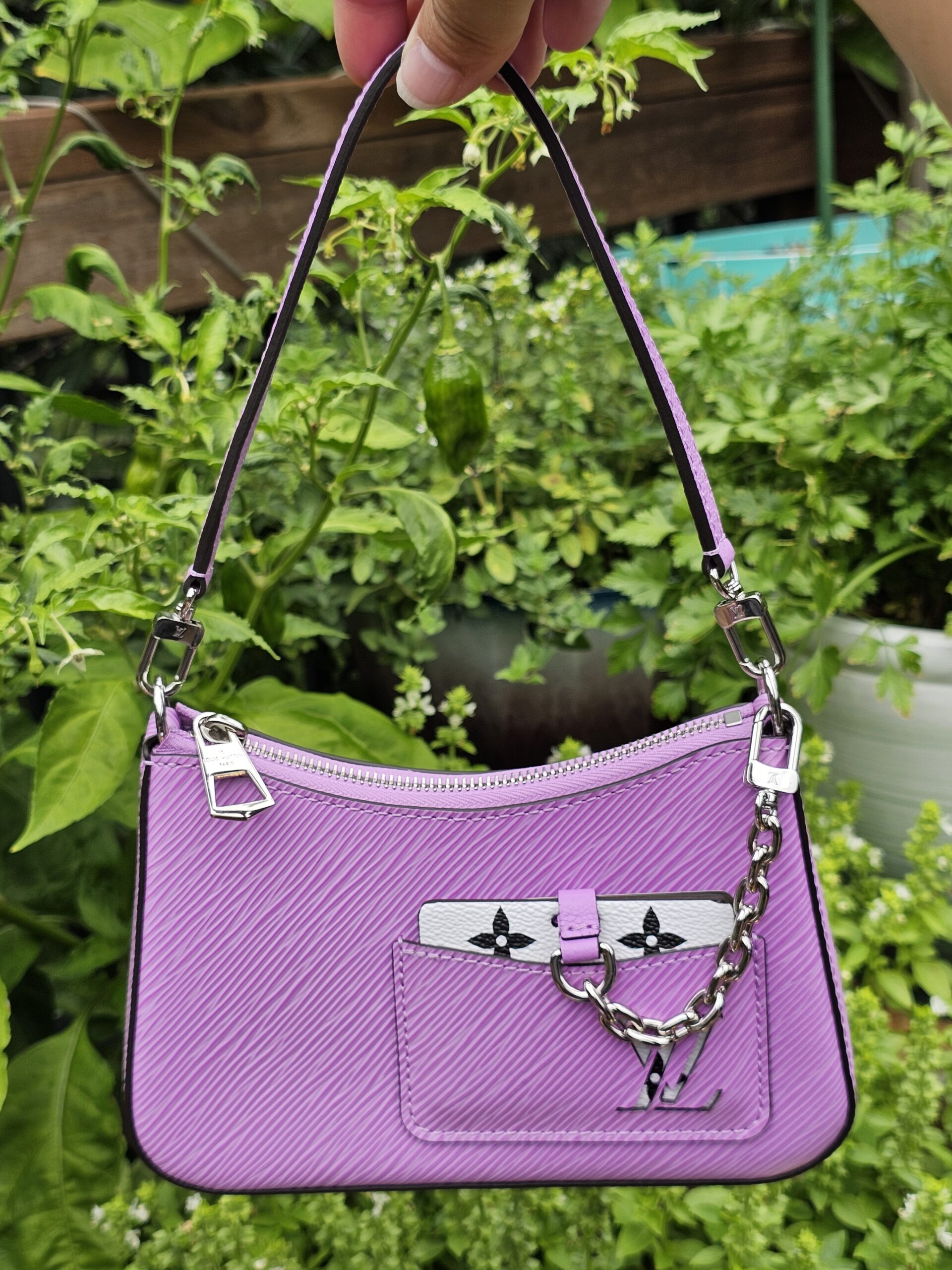 Front of the Louis Vuitton Epi Marellini in purple Epi leather with silver-tone chain and Monogram charm