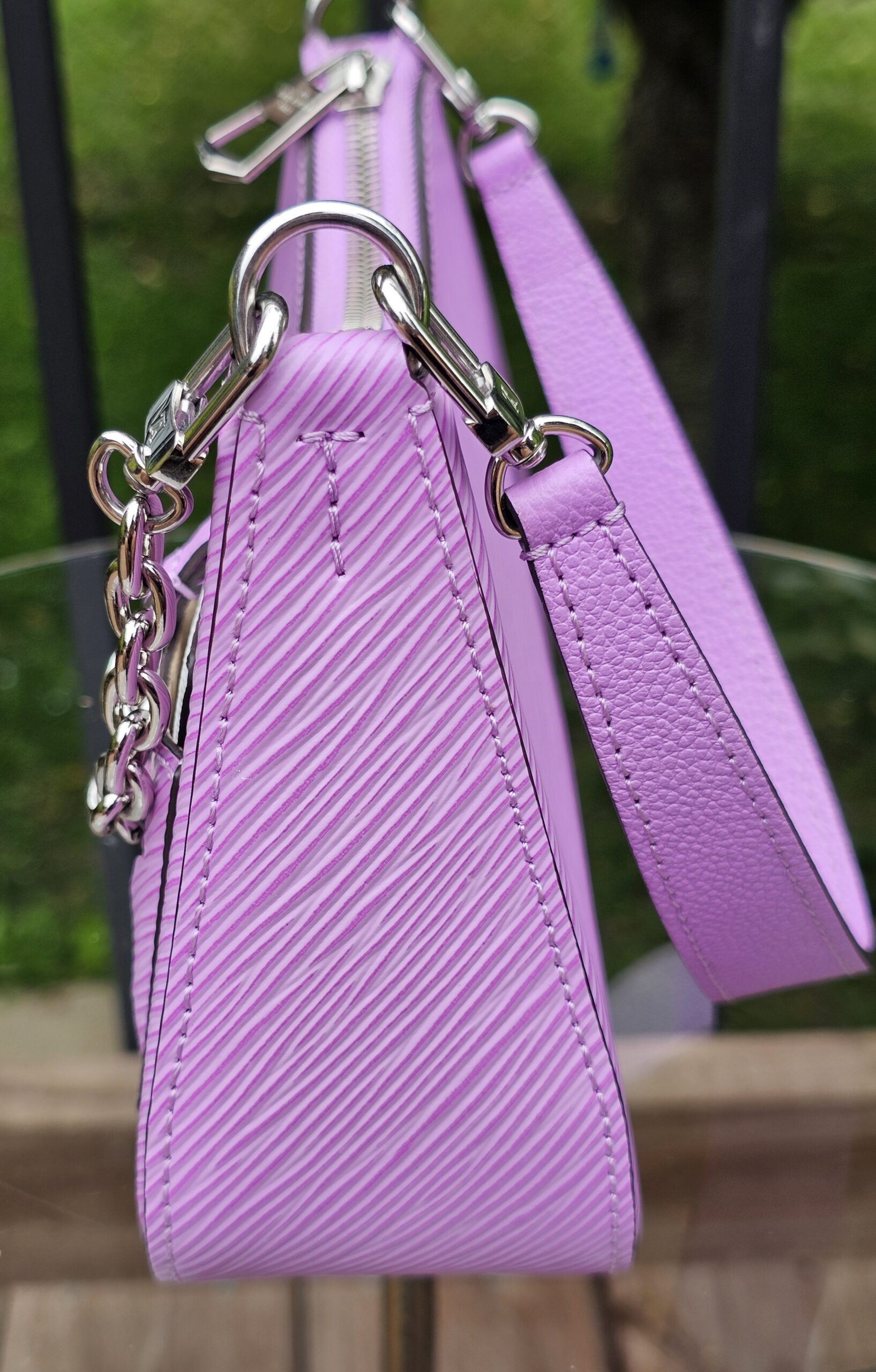 Slim side profile of the Louis Vuitton Epi Marellini in purple Epi leather