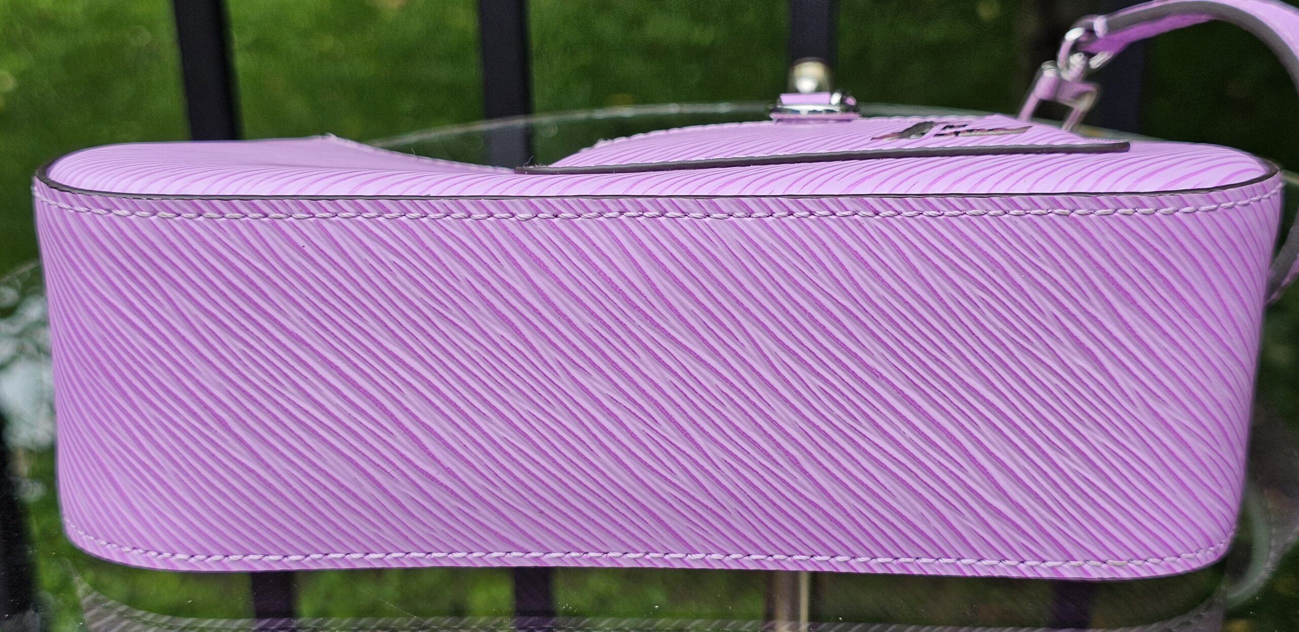 Base of the Louis Vuitton Epi Marellini in purple Epi leather