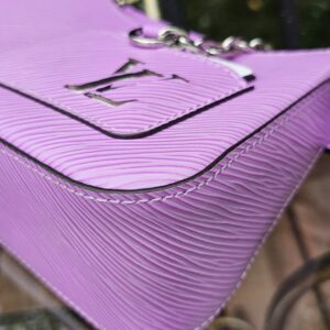 Silver-tone LV plaque on the front panel of the Louis Vuitton Epi Marellini