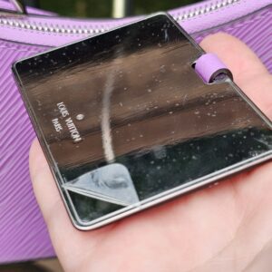 Phone reading the Louis Vuitton Epi Marellini microchip to verify authenticity by NFC