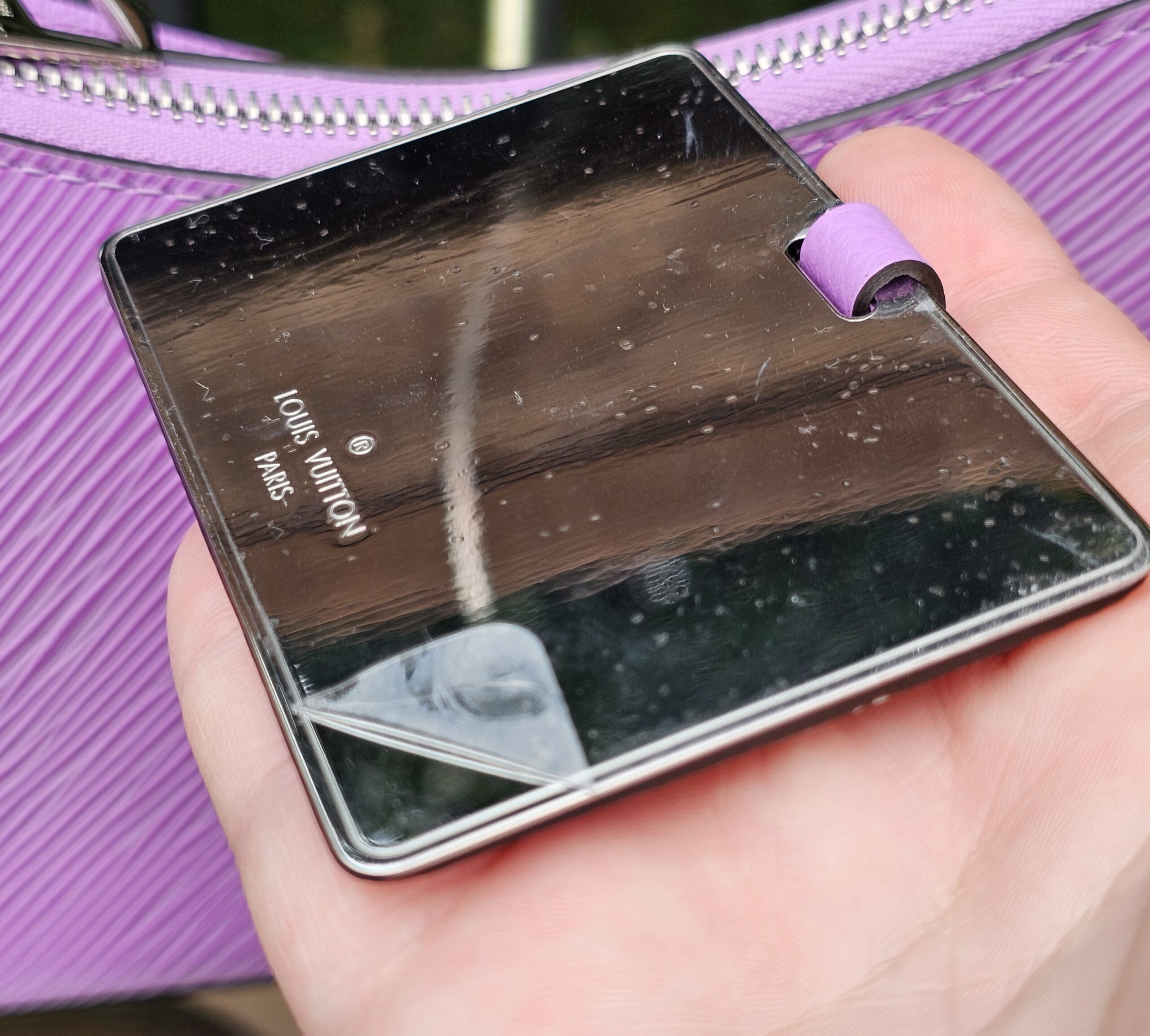 Phone reading the Louis Vuitton Epi Marellini microchip to verify authenticity by NFC