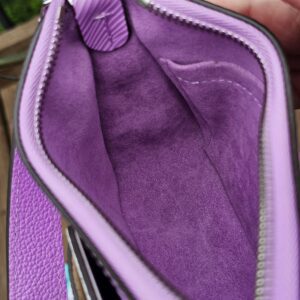Louis Vuitton Epi Marellini held open showing the clean purple interior