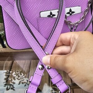 Louis Vuitton Epi Marellini carried with the long Epi leather strap, shown for scale