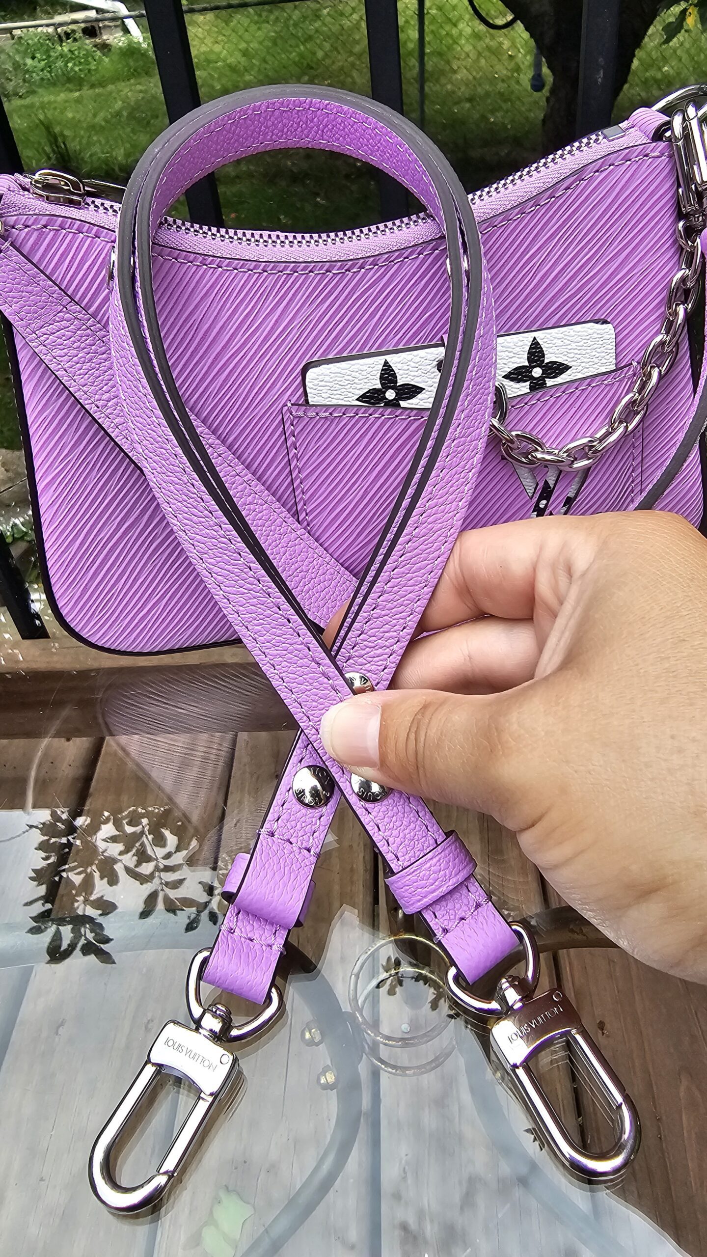Louis Vuitton Epi Marellini carried with the long Epi leather strap, shown for scale