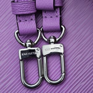 Silver-tone clasps stamped Louis Vuitton on the Epi Marellini shoulder strap