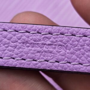 Louis Vuitton engraved on the purple Epi leather strap of the Marellini
