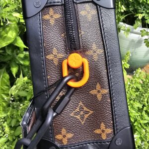 Louis Vuitton Monogram Solar Ray Soft Trunk held in hand to show scale