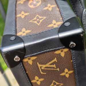Monogram coated canvas meeting black leather trim on the Louis Vuitton Solar Ray Soft Trunk