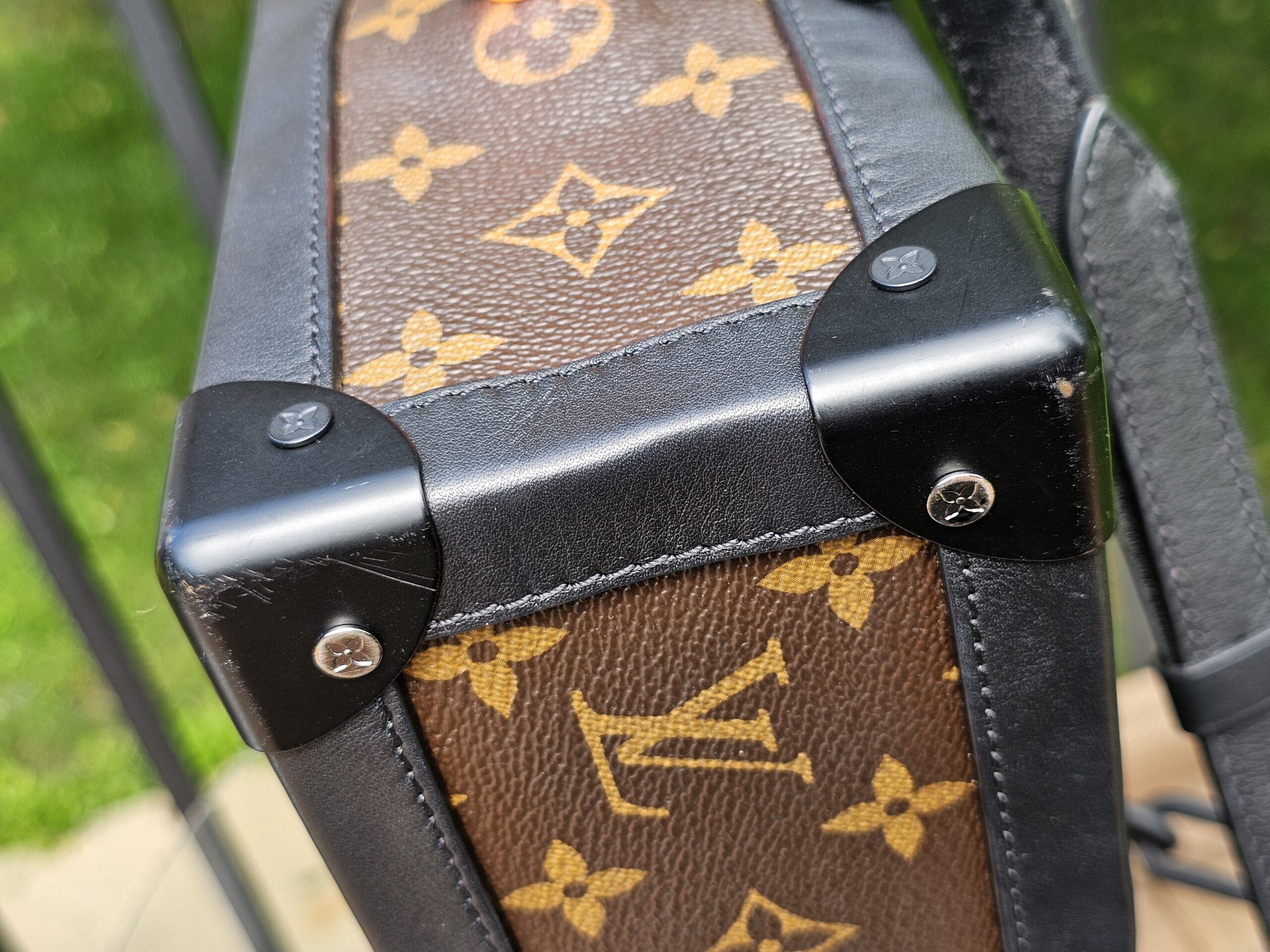 Monogram coated canvas meeting black leather trim on the Louis Vuitton Solar Ray Soft Trunk