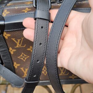 Detachable adjustable black leather strap of the Louis Vuitton Monogram Solar Ray Soft Trunk