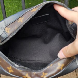 Black textile lined interior of the Louis Vuitton Monogram Solar Ray Soft Trunk