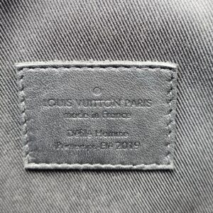 Interior stamp reading Louis Vuitton Paris made in France Defile Homme Printemps-Ete 2019 inside the Solar Ray Soft Trunk
