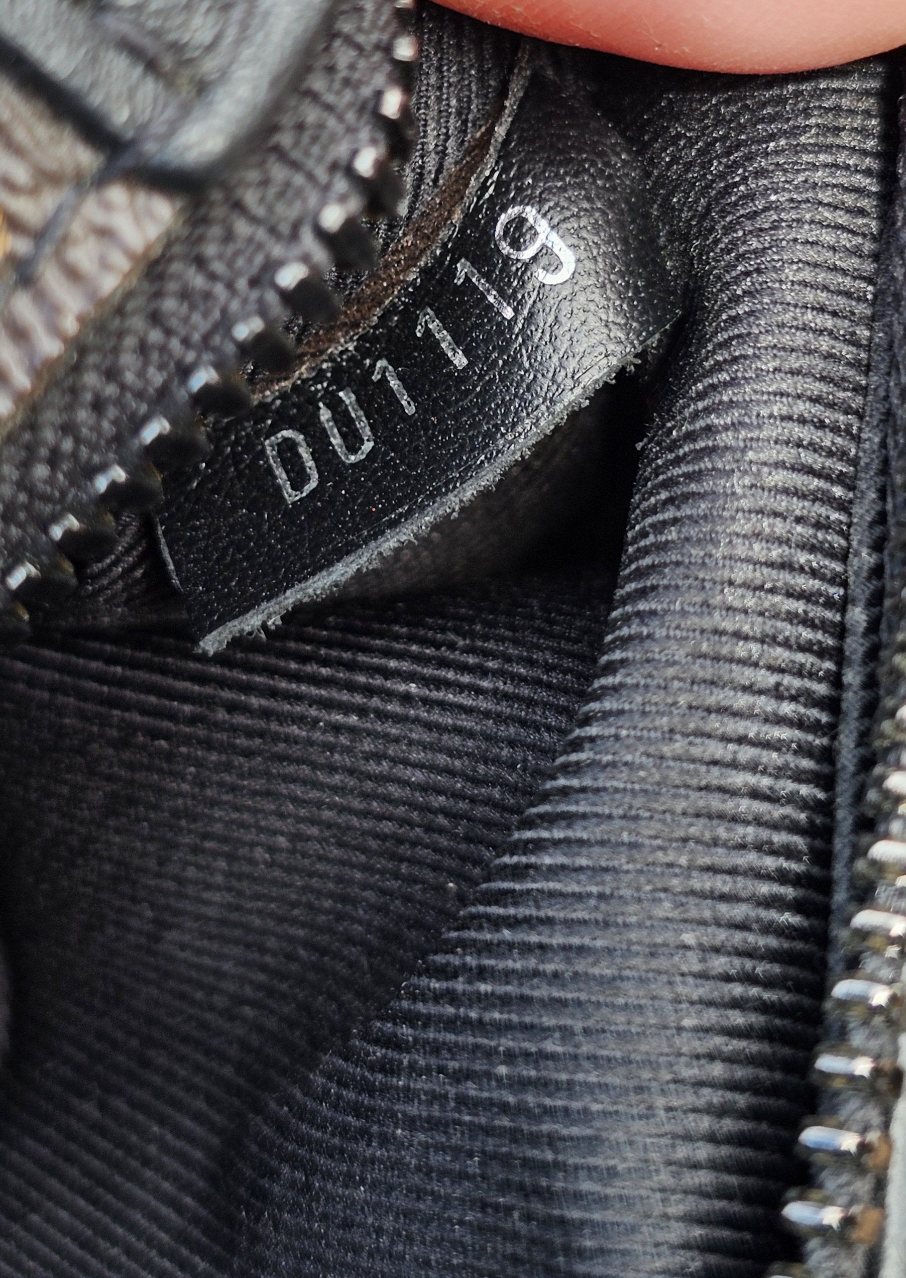 Date code DU1119 stamped inside the Louis Vuitton Monogram Solar Ray Soft Trunk