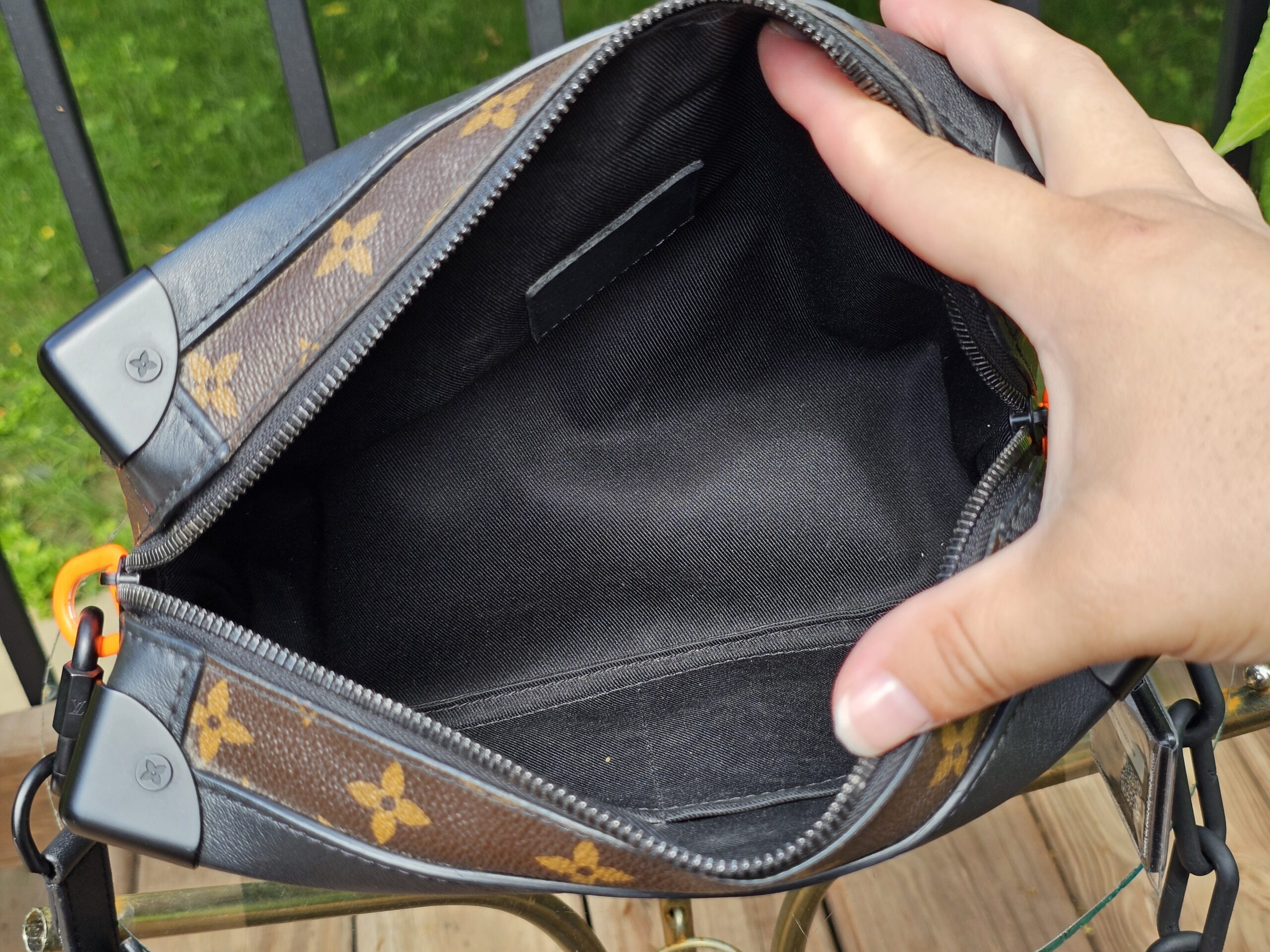 Interior flat pockets inside the Louis Vuitton Monogram Solar Ray Soft Trunk