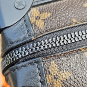 Close-up of the zip track and black leather trim on the Louis Vuitton Solar Ray Soft Trunk