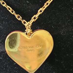 Gold-tone reverse of the heart pendant engraved Louis Vuitton Paris