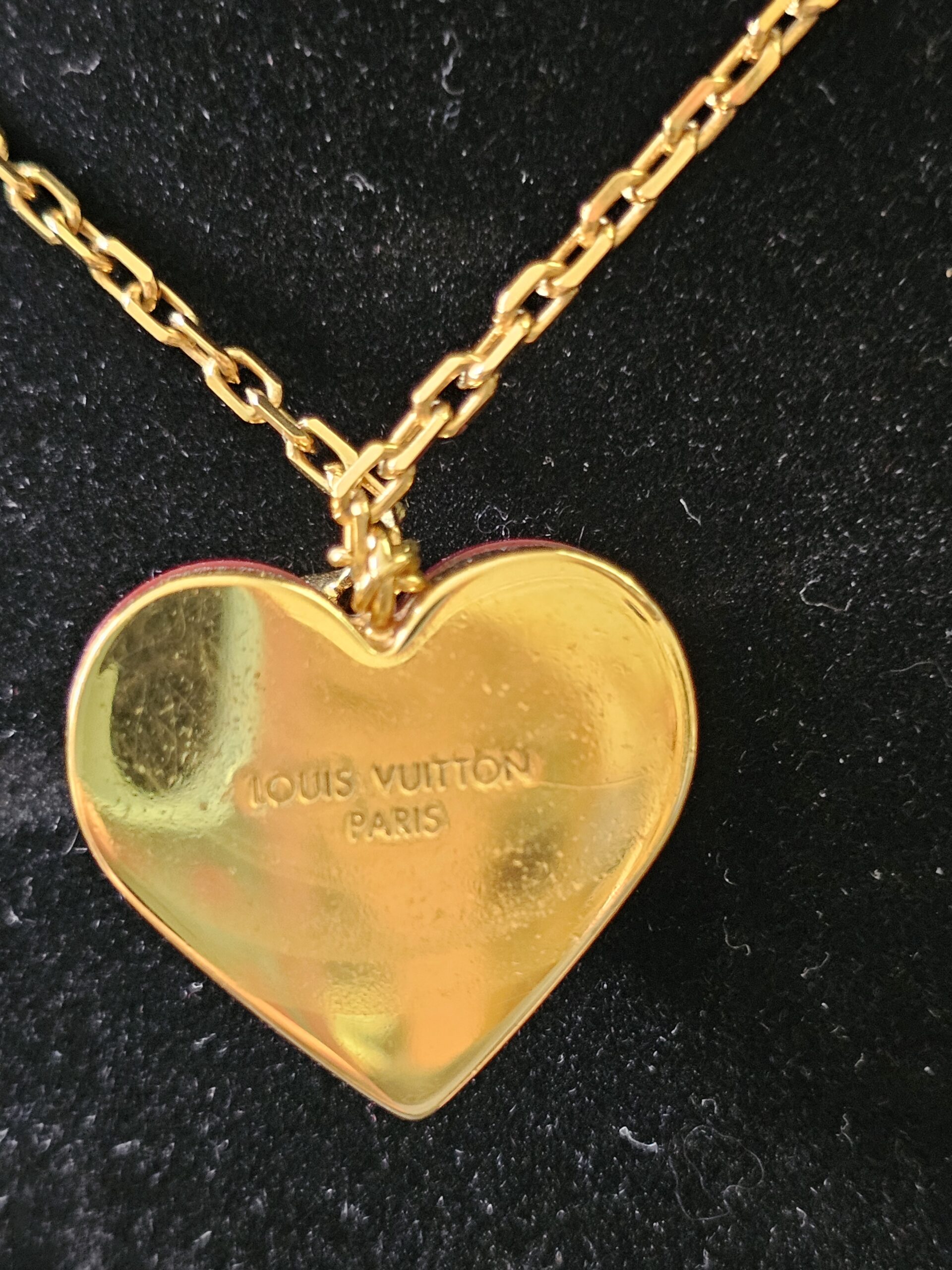 Gold-tone reverse of the heart pendant engraved Louis Vuitton Paris