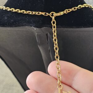 LV logo extender on the adjustable chain of the Louis Vuitton Lock Me heart necklace