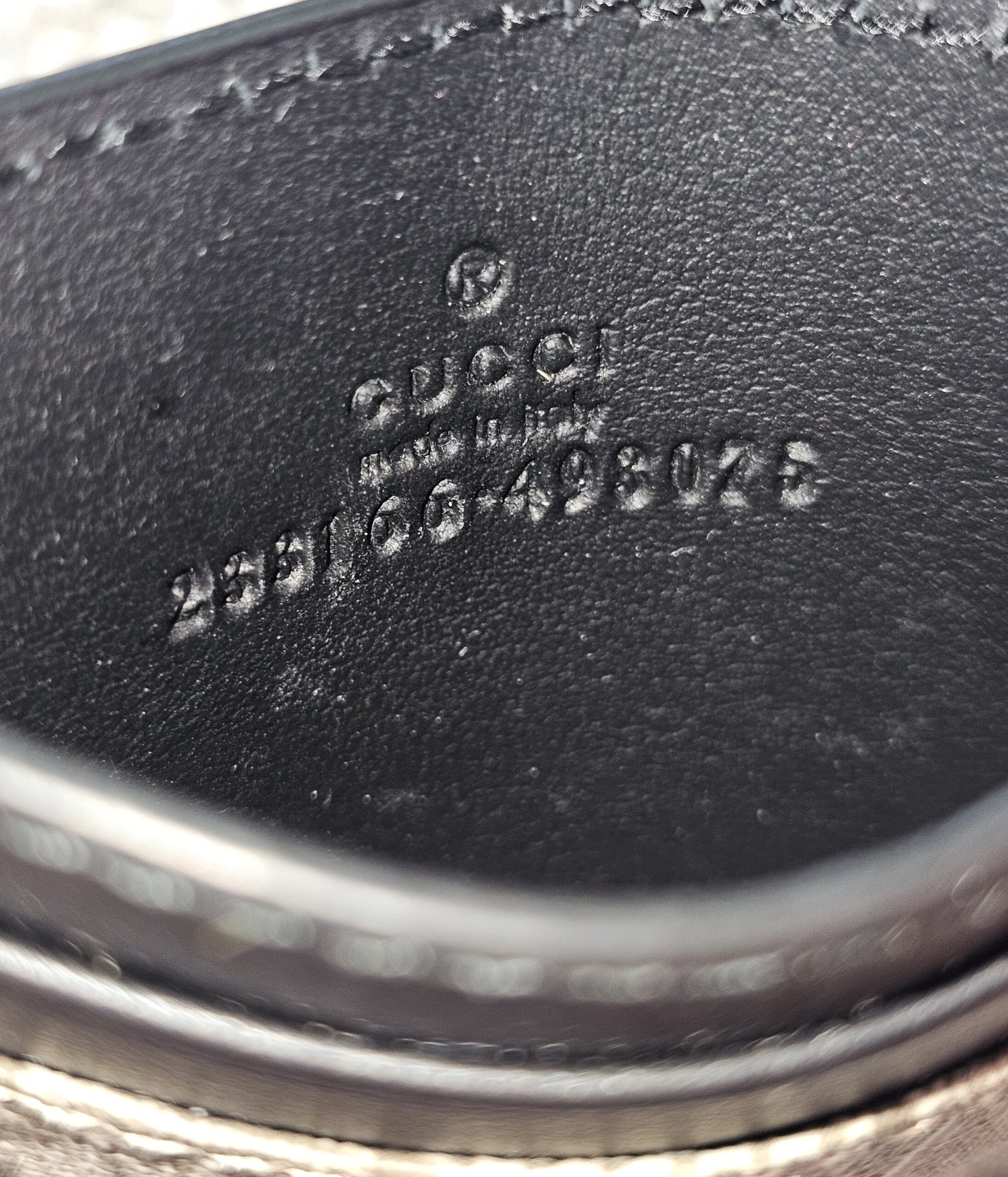 Gucci made in Italy stamp embossed inside the GG Supreme Essence card holder