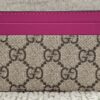 Gucci Essence card holder in beige GG Supreme canvas with vibrant pink calfskin trim