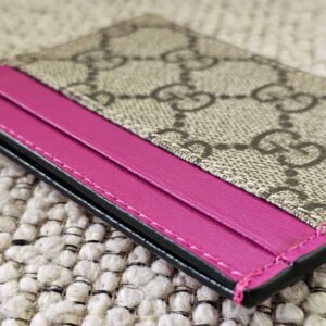 Slim side profile of the Gucci GG Supreme Essence card holder in pink calfskin