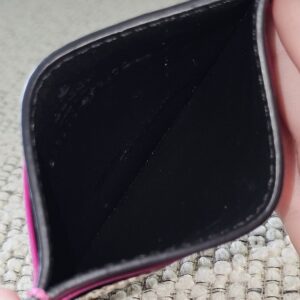 Center compartment of the Gucci Essence card holder lined in black leather