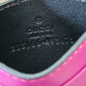 Style code embossed inside the Gucci GG Supreme Essence card holder