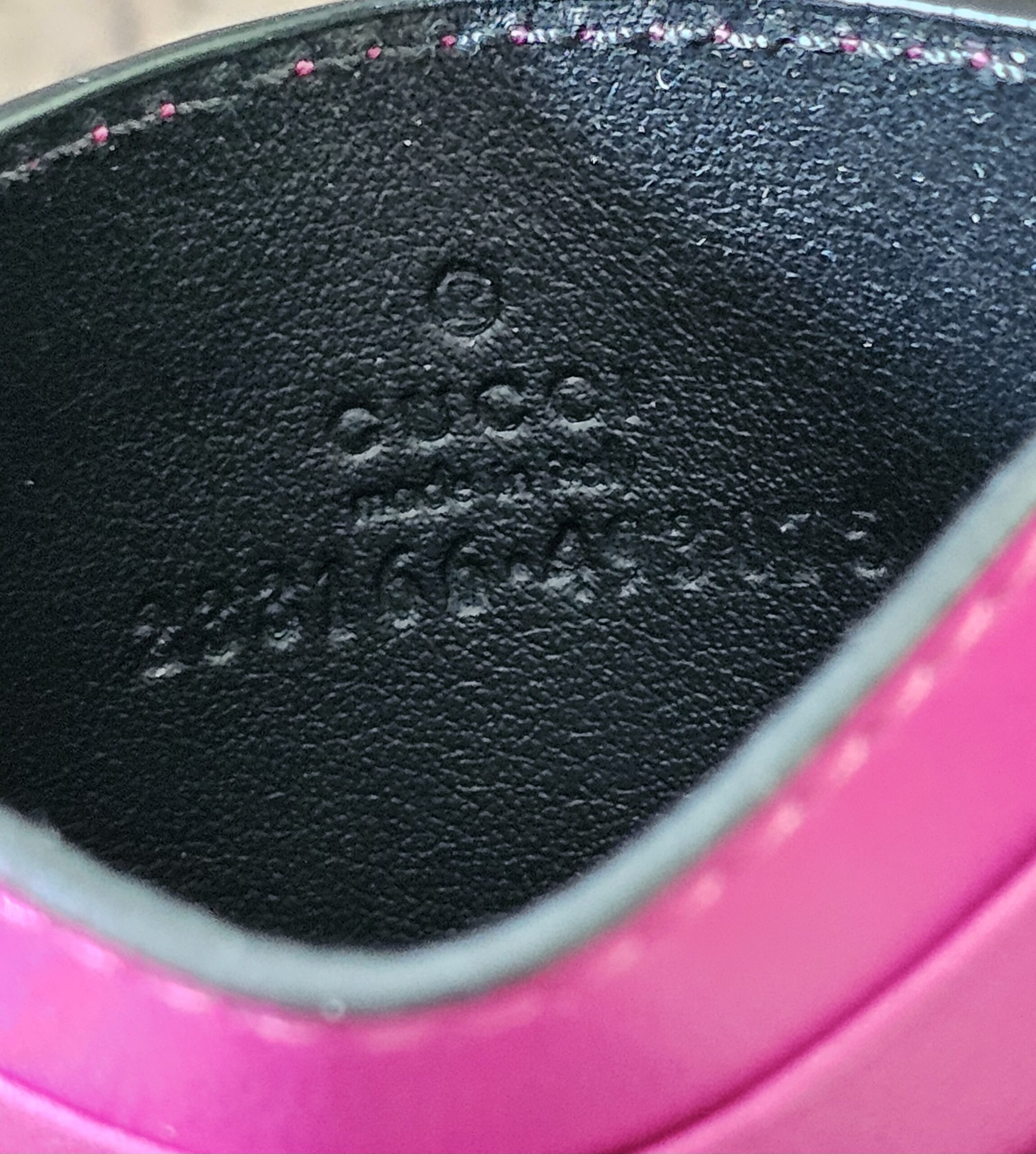 Style code embossed inside the Gucci GG Supreme Essence card holder