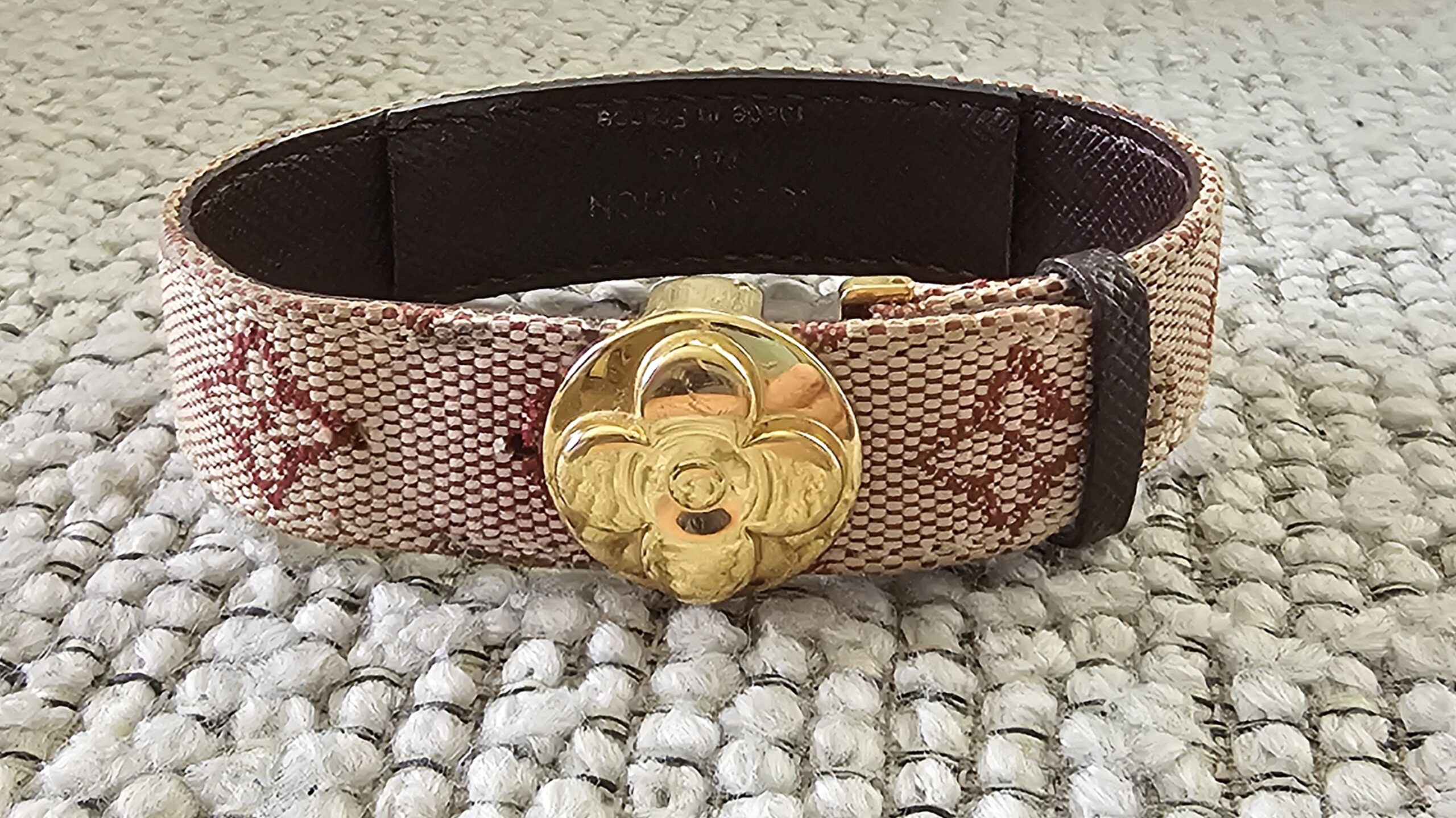 Louis Vuitton Millennium Wish bracelet in Monogram Mini Lin canvas with a gold-tone LV flower closure