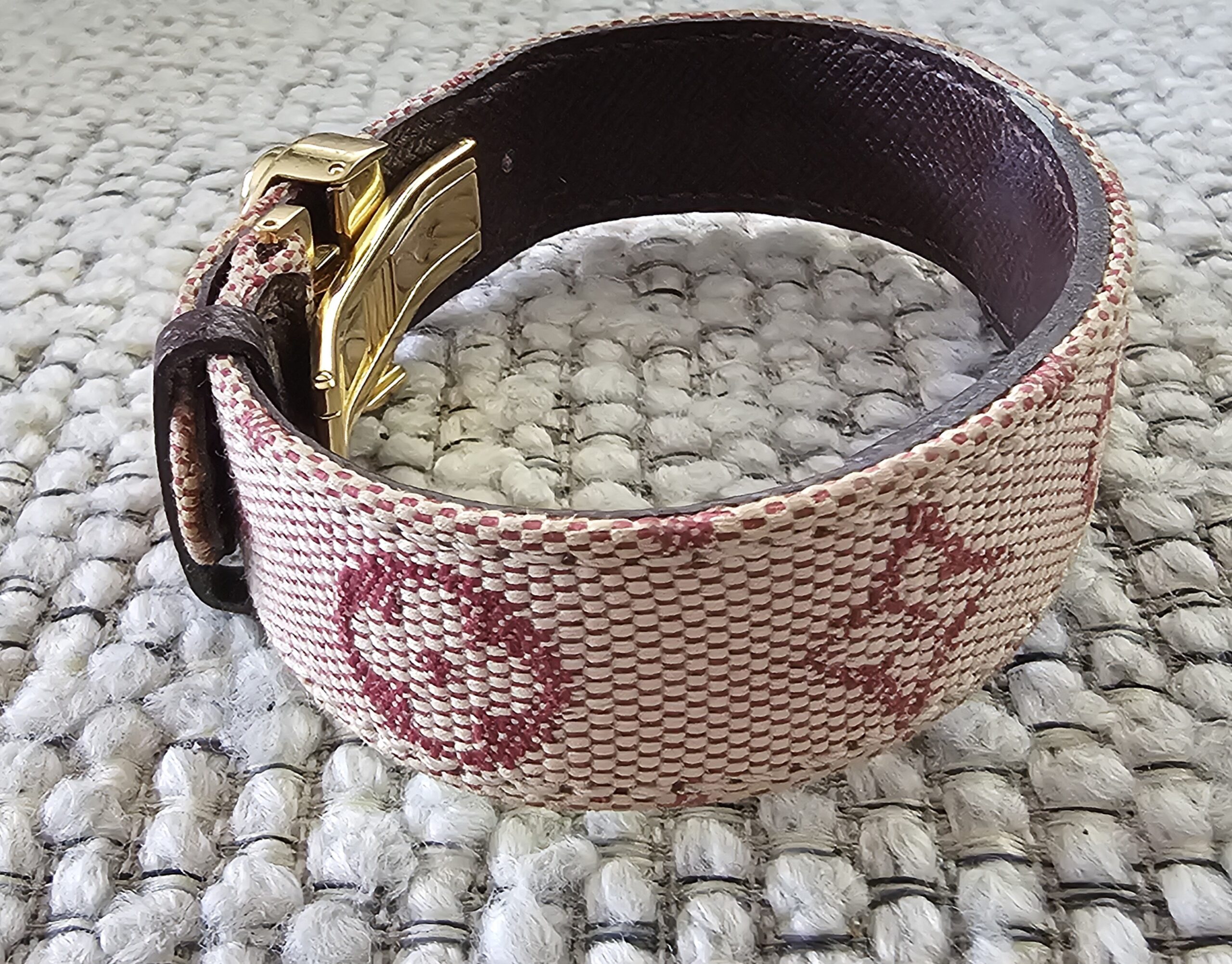 Monogram Mini Lin canvas with burgundy print on the Louis Vuitton Millennium Wish bracelet