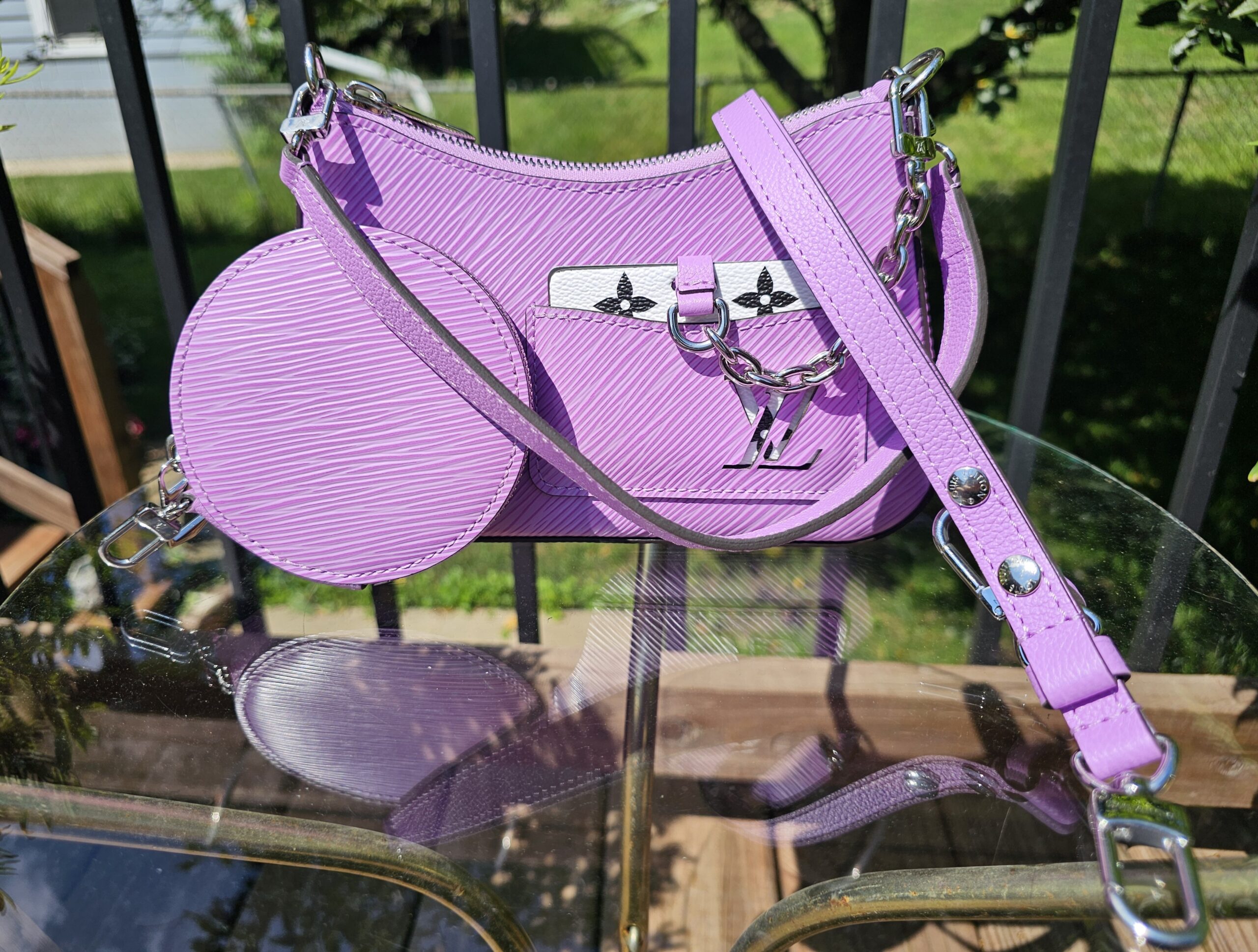 Louis Vuitton Marellini in purple Epi leather shown with its matching round Epi coin pouch and strap