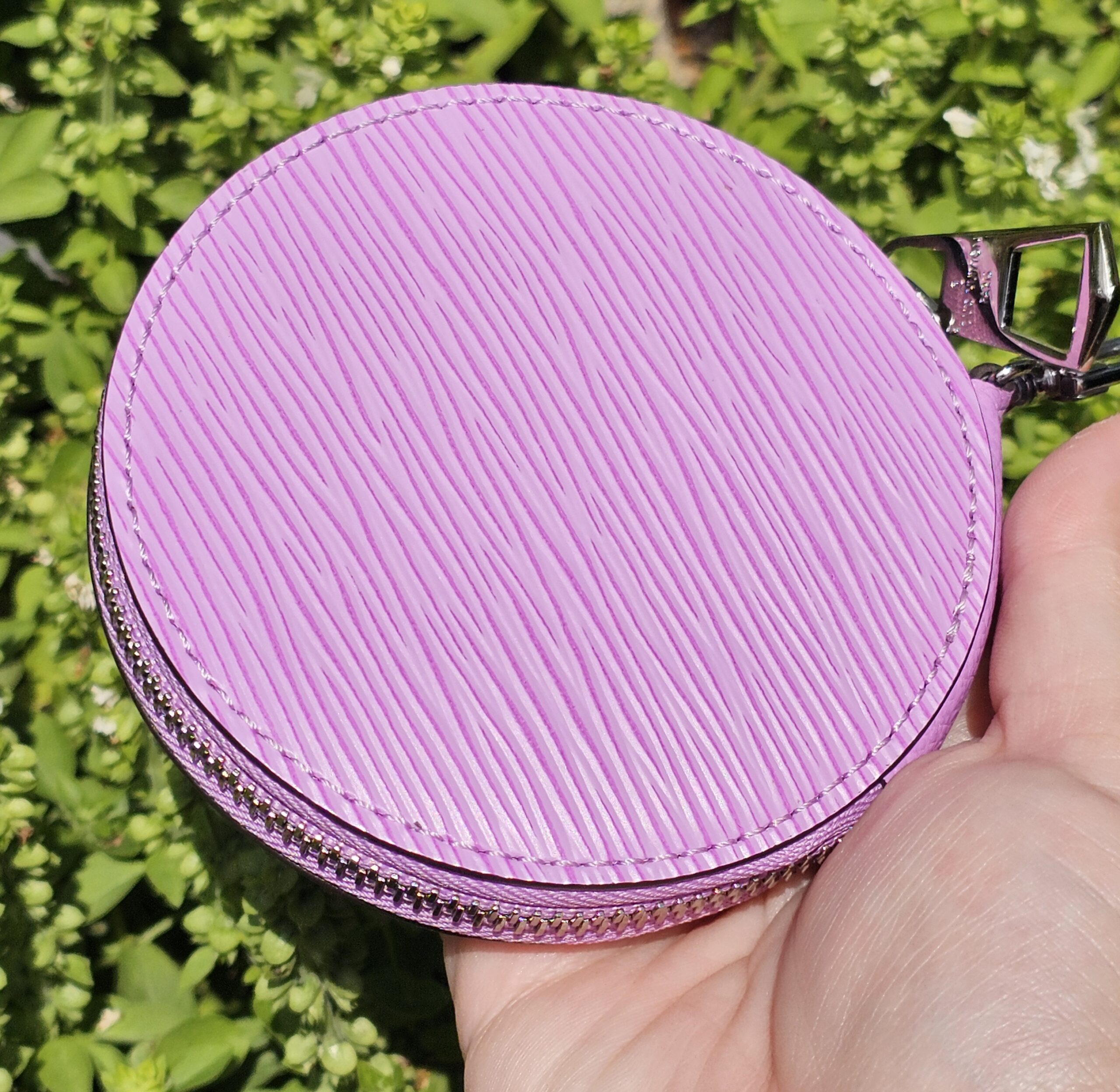 Front of the round purple Epi coin pouch included with the Louis Vuitton Marellini