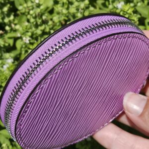 Silver-tone zip around the round purple Epi coin pouch
