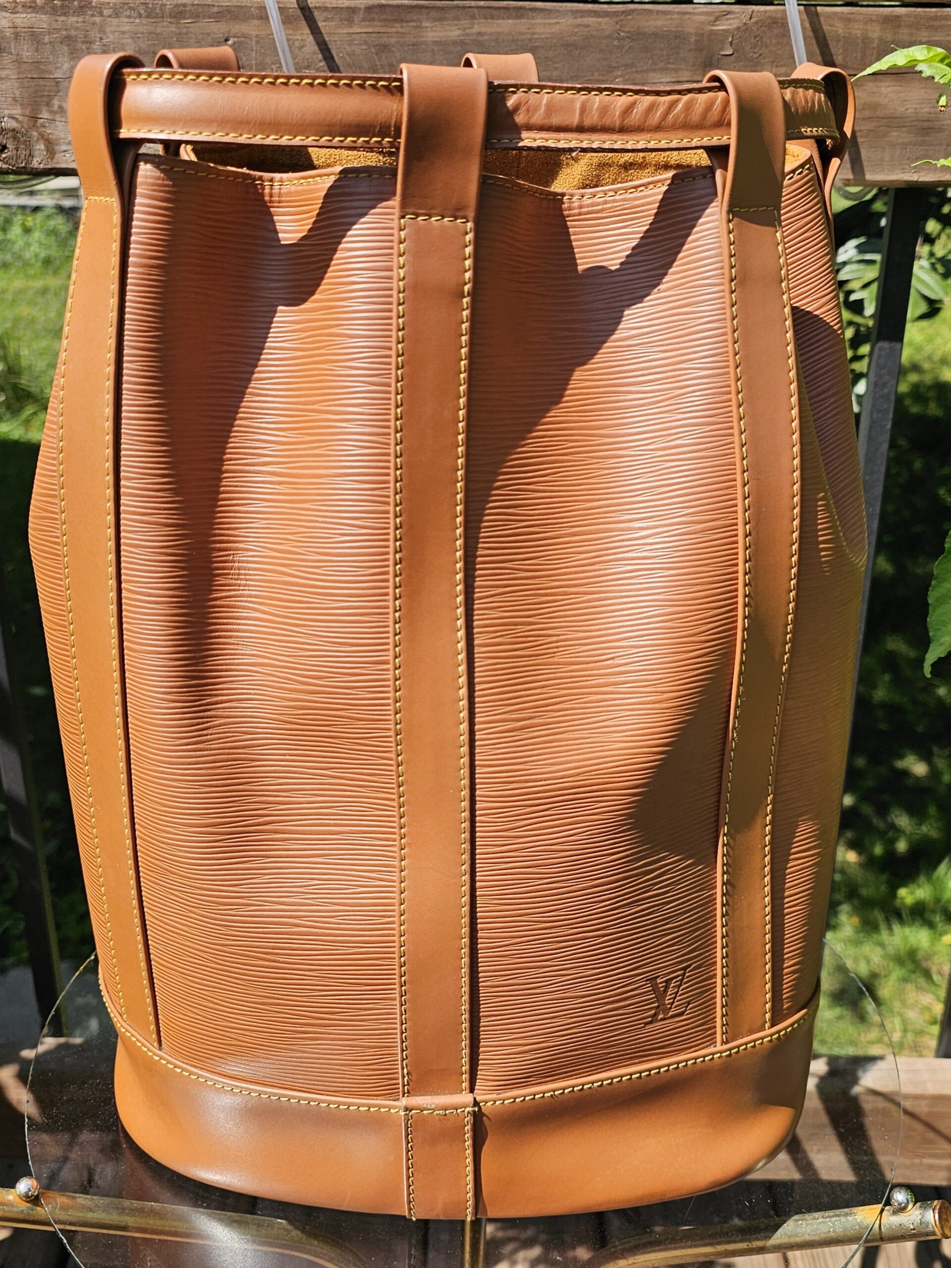 Front of the vintage Louis Vuitton Epi Randonnee PM in Cipango Gold leather